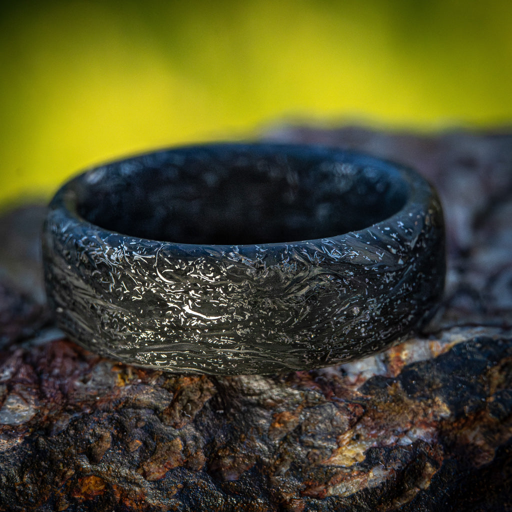 Carbon fiber ring with titanium shavings