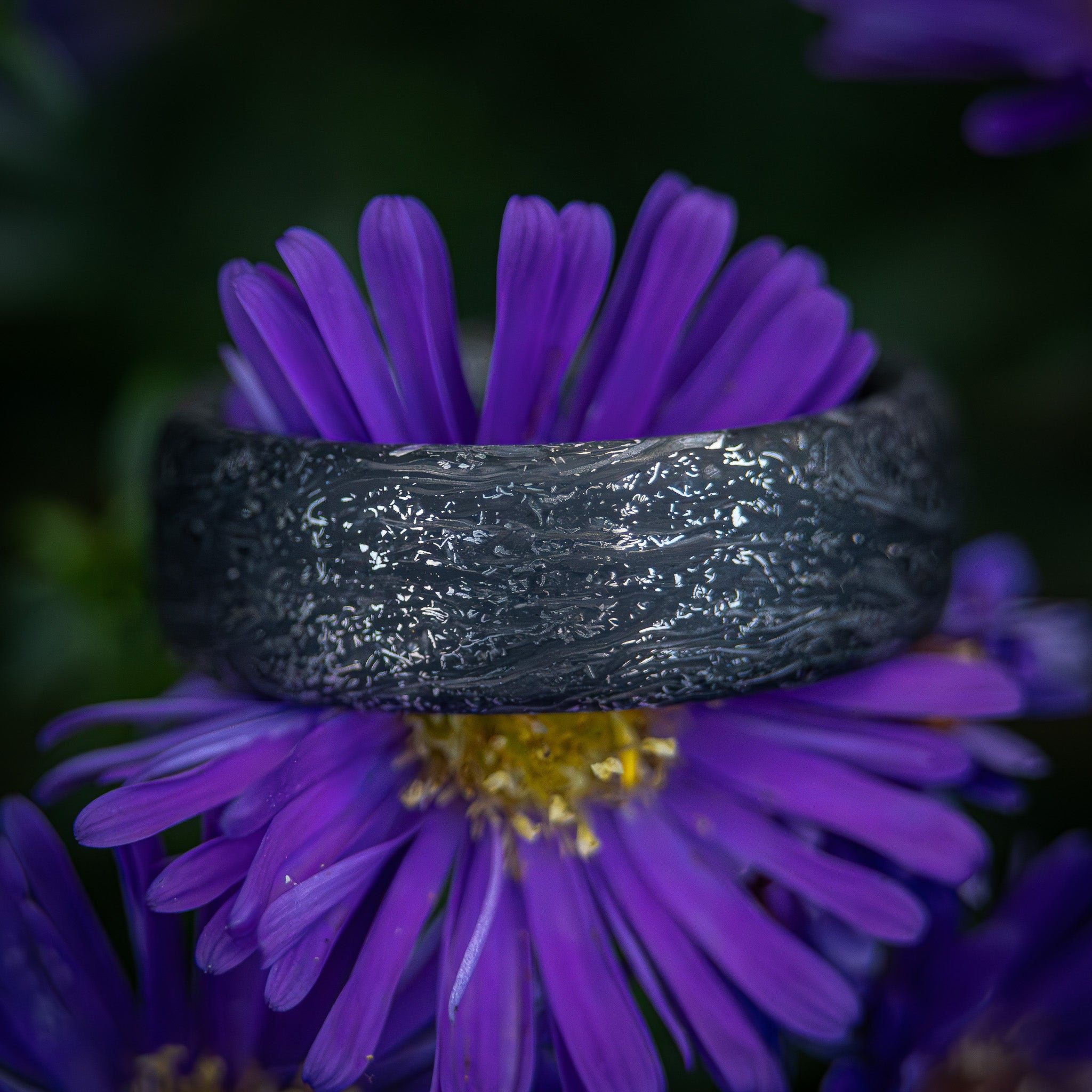 Carbon fiber ring with titanium shavings