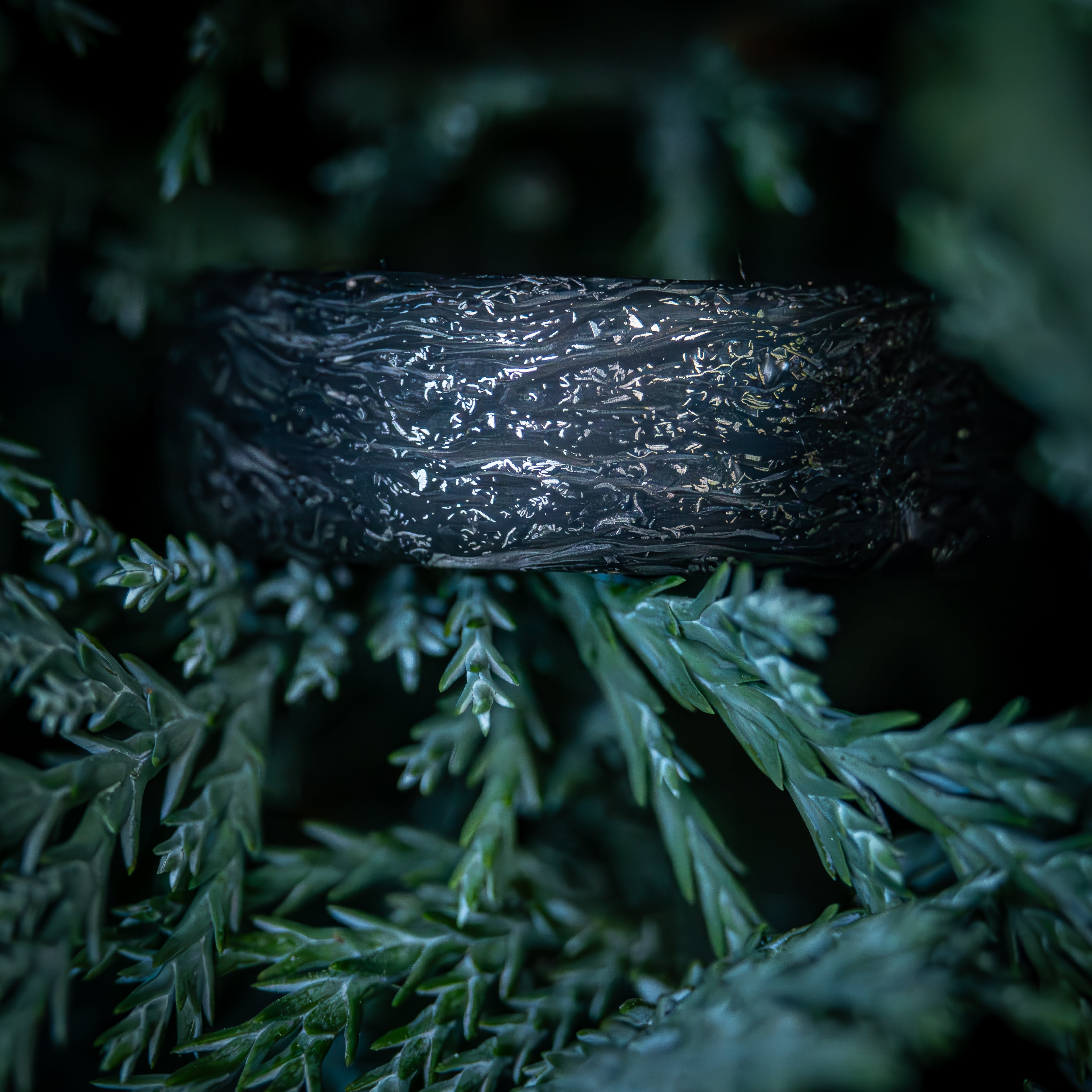 Carbon fiber ring with titanium shavings
