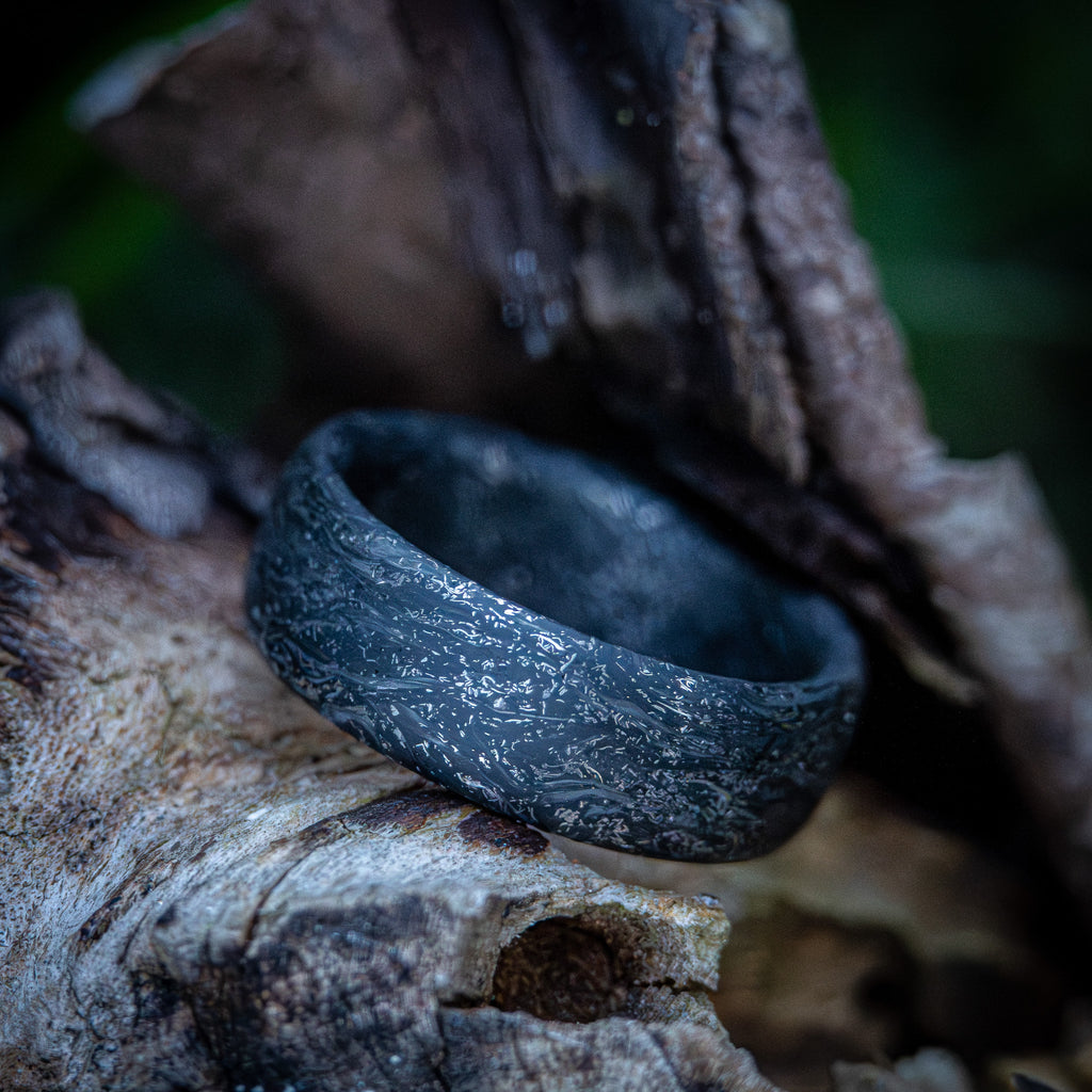 Carbon fiber ring with titanium shavings